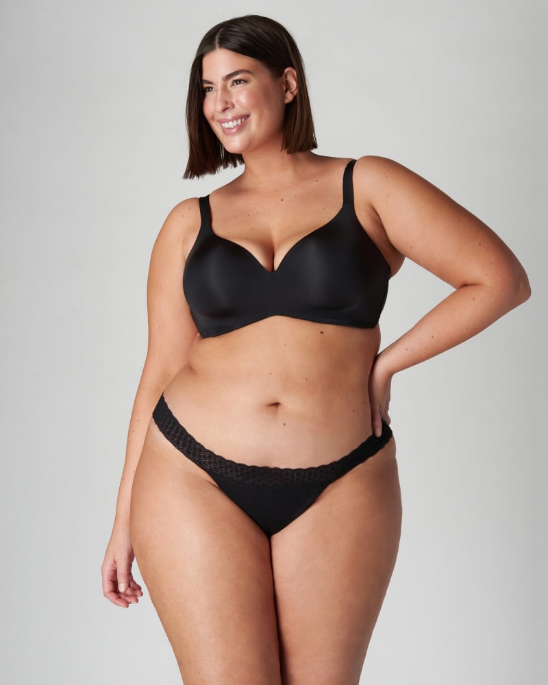 Front of a model wearing a size 2XL Period-Proof Organic Cotton Thong - 1 Tampon Absorption in Black by Viita Protection. | dia_product_style_image_id:282251